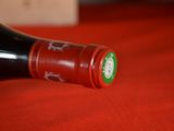 a bottle of wine that is sitting on a table