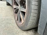 a close up of a car tire on the street
