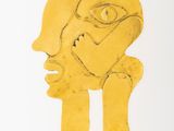 an image of a yellow sculpture of a man ' s face on a white surface