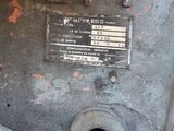 a close up view of a rusted machine with a sign on it