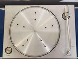a turntable with a silver plate on top of it