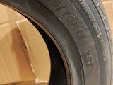 tires are stacked on top of cardboard boxes in a room