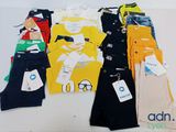 a lot of children ' s clothing on display on a table