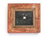 an old picture frame with a piece of wood in it on a white wall