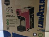 a box of a coffee maker sitting on top of a counter