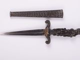 pair of old iron daggers on a white surface with a white background