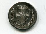 une vieille pièce de monnaie sur laquelle figure un blason