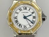 a close up of a watch with roman numerals on the face