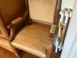 a chair that is next to a radiator in a room