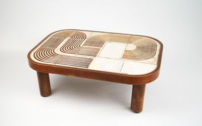 a coffee table that has a design on the top of it