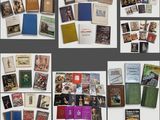 many different types of books on display on the wall