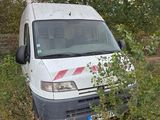 a white van that is parked in the grass