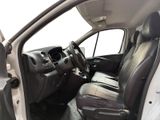 the interior of a car with the door open and the driver ' s seat down
