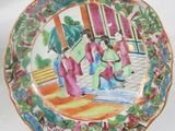 a plate with a picture of a woman on it
