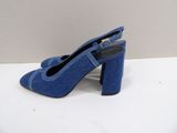 a close up of a pair of blue shoes on a white surface