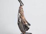 statue of a woman holding a bird on a pedestal