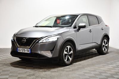 the silver nissan suv is parked on a checkered floor