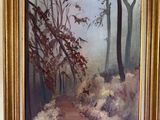 a painting of a path in the woods on the wall