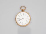 an antique gold pocket watch with roman numerals and roman numerals on the dial