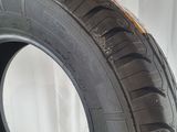 a close up of a tire on a white surface