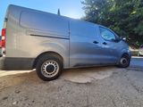 a silver van parked on the side of the road