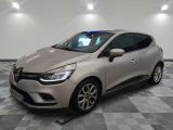a silver car parked in a room with a checkered floor