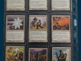 a lot of cards that are in a binder