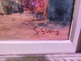 a painting on the window sill of a building that says queen
