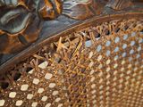 a close up of a chair with a decorative design on it