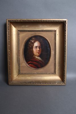 an old picture of a man in a red coat is hanging on a wall