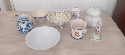 a table with a lot of dishes and bowls on it