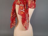 an image of a red scarf on a mannequin head