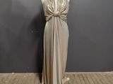 the mannequin is standing in front of the wall with a dress on it
