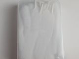 a plastic container with a white cloth inside of it