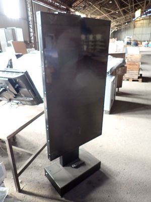 an image of a television on a stand in a warehouse