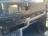the interior of a car with a dash camera and a dash panel