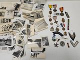 a lot of old photos and medals on the table