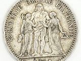 a close up of a silver coin with a woman on it