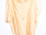 an image of a dress hanging on a hanger on a white wall