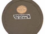a picture of a round metal object with a tag on it
