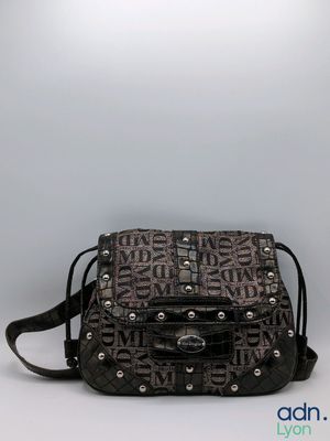 black and brown handbag with studded handle and shoulder strap