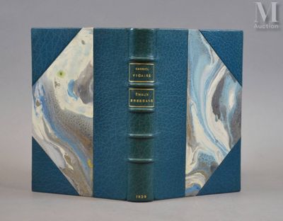 a blue book with a marbled cover on it