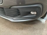 a close up of the front bumper of a car