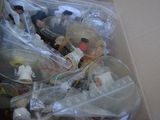 a person holding a box full of toys in it