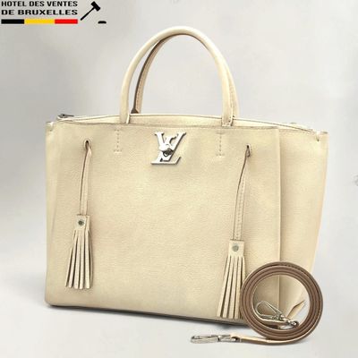 louis vuitton beige leather tote bag with tassels