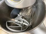 a bowl with a whisk and a whisk in it