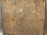 an image of a piece of wood with a cross drawn on it