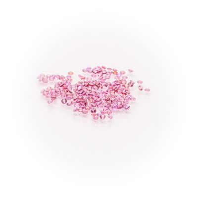 a pile of pink crystals on a white surface