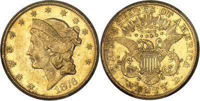 a gold coin with a woman ' s head and eagle on it