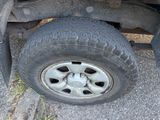 a flat tire on a flatbed truck on the ground